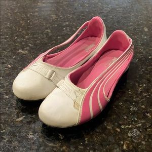 White and pink Puma flats